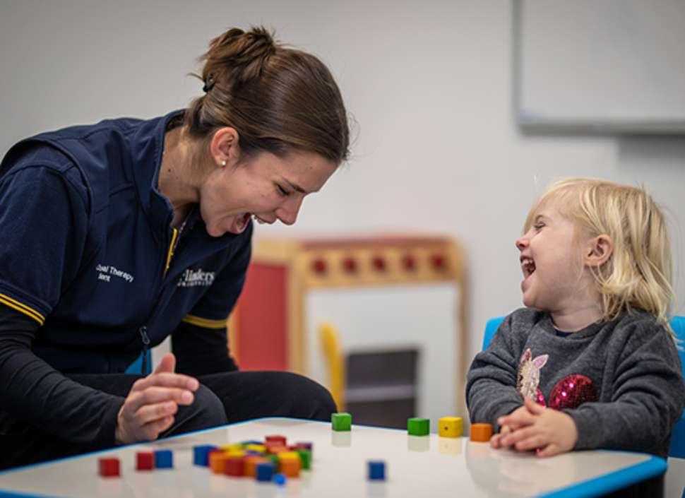 OT plays blocks with child
